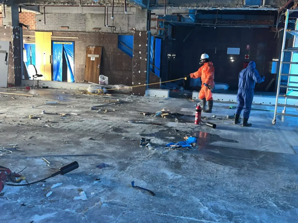 PureSafe team performing asbestos removal, demolition, and excavation services on a commercial site in Sydney.