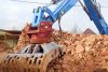 puresafe-excavator-2 A close-up of an excavator performing demolition service in NSW, Auburn, Sydney-Australia.